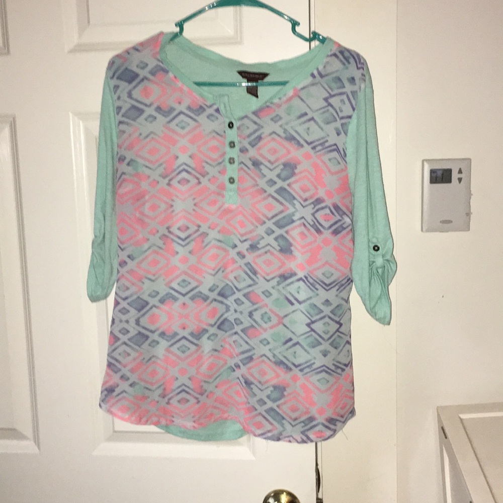 A teal and printed blouse